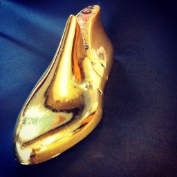 A shoe last in burnished 23 karat gold leaf. To benefit Museum L/A